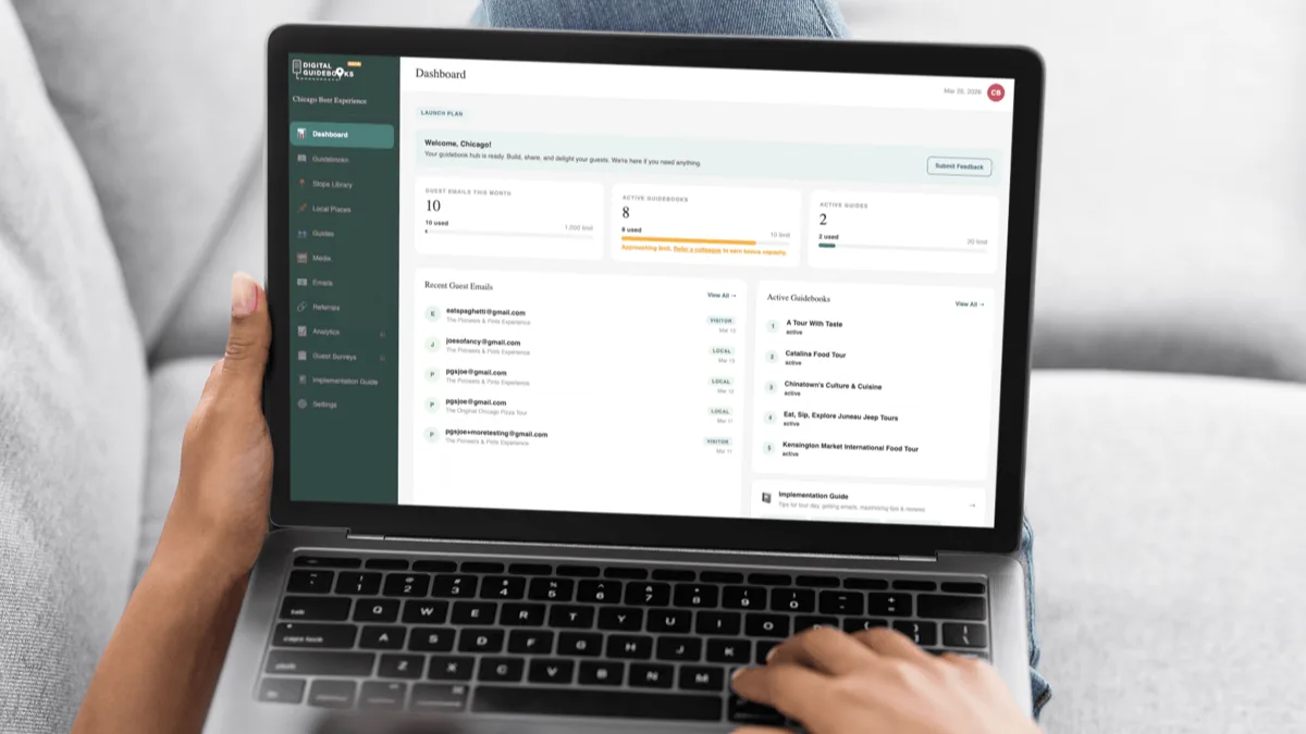 Digital Guidebooks admin dashboard on a laptop