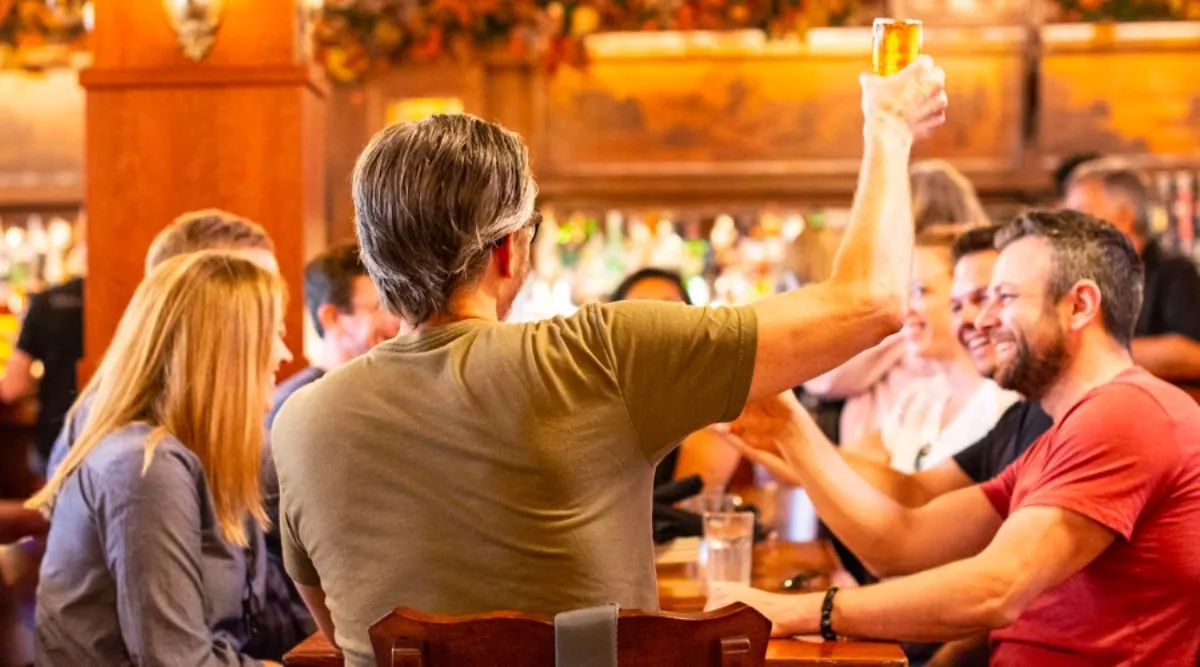 Tour guide leading guests through a food experience